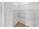 Walk-in pantry with wire shelving for ample storage and tile flooring at 312 Taxter Run Ln, Valrico, FL 33594