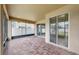 Spacious screened patio with brick flooring and sliding glass doors that let in lots of natural light at 312 Taxter Run Ln, Valrico, FL 33594