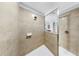 Contemporary shower features light beige tiling and chrome hardware at 312 Taxter Run Ln, Valrico, FL 33594