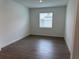 Clean bedroom with tile flooring and a sunny window at 31753 Griffin Sands Ln, San Antonio, FL 33576