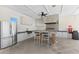 Outdoor kitchen featuring stainless steel appliances, bar seating, and plenty of counter space at 3214 Painted Blossom Ct, Lutz, FL 33558