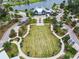 Beautiful community lawn perfect for recreation and community events, surrounded by walking paths and landscaping at 3822 Balcony Breeze Dr, Land O Lakes, FL 34638