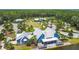 Aerial view of a community clubhouse and other recreational amenities surrounded by scenic views at 3822 Balcony Breeze Dr, Land O Lakes, FL 34638