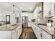 Gourmet kitchen features granite countertops, stainless steel appliances, and ample storage space at 3822 Balcony Breeze Dr, Land O Lakes, FL 34638