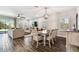 Spacious living and dining area with hardwood floors, neutral color palette and lots of natural light at 3822 Balcony Breeze Dr, Land O Lakes, FL 34638