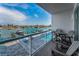 Balcony overlooking the community pool and waterway with boat docks and waterfront homes at 415 Island Way # 205, Clearwater Beach, FL 33767
