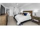 Cozy bedroom featuring modern decor, wood furniture, and bright natural lighting at 415 Island Way # 205, Clearwater Beach, FL 33767