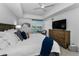 Bedroom features large windows with natural lighting and a view of the intercoastal at 415 Island Way # 205, Clearwater Beach, FL 33767