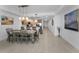 Spacious dining area featuring wooden table with seating, open to kitchen and great natural lighting at 415 Island Way # 205, Clearwater Beach, FL 33767