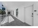 Bright hallway showcases access to condos and a view of the building's exterior at 415 Island Way # 205, Clearwater Beach, FL 33767