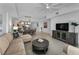 Open living space features a large sectional couch, dining area, and modern kitchen at 415 Island Way # 205, Clearwater Beach, FL 33767