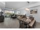 Open-concept living space with dining area and water views from large windows at 415 Island Way # 205, Clearwater Beach, FL 33767