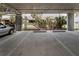 Indoor parking garage with assigned parking spots and views of the exterior at 415 Island Way # 205, Clearwater Beach, FL 33767