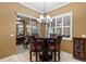 The breakfast area features plantation shutters and a modern chandelier at 4508 Compass Oaks Dr, Valrico, FL 33596