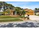 Lovely single-Gathering home showcasing a manicured lawn and a charming fountain in the front yard at 4508 Compass Oaks Dr, Valrico, FL 33596