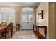 Elegant foyer with tile flooring, decorative front doors, and stylish console table at 4508 Compass Oaks Dr, Valrico, FL 33596