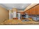 Kitchen featuring granite countertops, stainless steel appliances, and breakfast bar seating at 4508 Compass Oaks Dr, Valrico, FL 33596