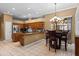 Eat-in kitchen featuring stainless steel appliances, an island, and a breakfast bar at 4508 Compass Oaks Dr, Valrico, FL 33596