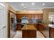The kitchen offers granite countertops, stainless steel appliances and tiled floors at 4508 Compass Oaks Dr, Valrico, FL 33596