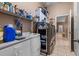 An organized laundry room provides storage, white cabinets and tile flooring at 4508 Compass Oaks Dr, Valrico, FL 33596