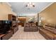 Open living space featuring tile flooring, comfortable furniture, and seamless flow to the kitchen at 4508 Compass Oaks Dr, Valrico, FL 33596