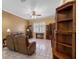 Inviting living room featuring neutral tones, ceiling fan, tile floors, and comfortable furniture at 4508 Compass Oaks Dr, Valrico, FL 33596