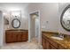 Dual granite vanities and tile floors complement this luxurious main bathroom at 4508 Compass Oaks Dr, Valrico, FL 33596