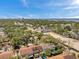 Scenic aerial view of a town featuring a mix of residential areas and commercial spaces, set against a bay backdrop at 4733 W Vasconia St, Tampa, FL 33629