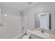 Clean bathroom featuring a shower-tub combo, toilet, and single sink vanity at 4733 W Vasconia St, Tampa, FL 33629