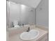Bathroom with vanity, neutral countertop, large mirror and a combined shower and tub at 4733 W Vasconia St, Tampa, FL 33629