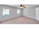 Bright bedroom with ceiling fan and natural light from windows at 4733 W Vasconia St, Tampa, FL 33629