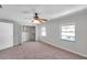 Bright bedroom with two windows and closet with shelving for storage at 4733 W Vasconia St, Tampa, FL 33629