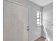 Bright entryway features a white front door and a small window, offering a welcoming entrance at 4733 W Vasconia St, Tampa, FL 33629