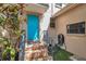 Inviting front entrance with a colorful door, brick steps, and lush landscaping at 4733 W Vasconia St, Tampa, FL 33629