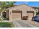 Charming townhouse featuring a two-car garage, landscaped yard, and inviting curb appeal at 4733 W Vasconia St, Tampa, FL 33629