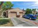 Charming townhouse featuring a two-car garage, landscaped yard, and inviting curb appeal at 4733 W Vasconia St, Tampa, FL 33629