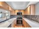 Updated kitchen featuring stainless steel appliances, tiled floors and ample countertop space at 4733 W Vasconia St, Tampa, FL 33629