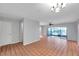 Spacious living room with tile floors, neutral walls, ceiling fan, and access to a screened-in lanai at 4733 W Vasconia St, Tampa, FL 33629