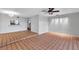 Living room features tile flooring, neutral walls, and access to a screened-in lanai at 4733 W Vasconia St, Tampa, FL 33629
