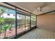 Tiled screened-in patio with lush landscaping, providing a private outdoor retreat at 4733 W Vasconia St, Tampa, FL 33629
