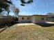 Large backyard with a concrete patio at 4911 Largo Ter, New Port Richey, FL 34652