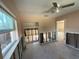 Bright bedroom with natural light and partially removed drywall, presenting renovation possibilities at 4911 Largo Ter, New Port Richey, FL 34652
