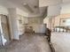 Kitchen featuring white cabinets and tile backsplash at 4911 Largo Ter, New Port Richey, FL 34652