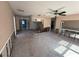 Sunlit living room featuring ceiling fan at 4911 Largo Ter, New Port Richey, FL 34652