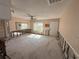 Spacious living room with natural light and a fan at 4911 Largo Ter, New Port Richey, FL 34652