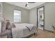 Comfortable bedroom with a window, a soft bed, and an ensuite bathroom, offering a relaxing retreat at 511 45Th N Ave, St Petersburg, FL 33703