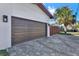 Attached two-car garage featuring a modern door and durable paver driveway at 511 45Th N Ave, St Petersburg, FL 33703