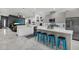 Open-concept kitchen with an island, stainless appliances, and seamless flow into the living area at 511 45Th N Ave, St Petersburg, FL 33703