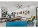 Spacious living area featuring modern furnishings and an open floor plan leading to a breakfast bar and stylish kitchen at 511 45Th N Ave, St Petersburg, FL 33703