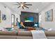 Bright living room featuring modern decor, stylish furniture, and a unique accent wall with decorative geometric paneling at 511 45Th N Ave, St Petersburg, FL 33703